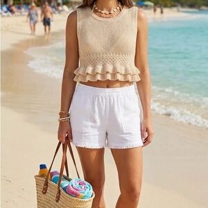 Sleeveless Ruffle-Hem Knit Crop Top in Cream